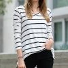 42POPS | Ivory & Black Stripe Dolphin-Hem V-Neck Long-Sleeve Top - Women